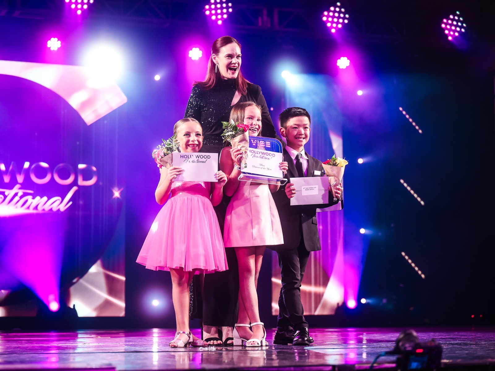 National Director Anne Smith with Dancers of the Year on stage