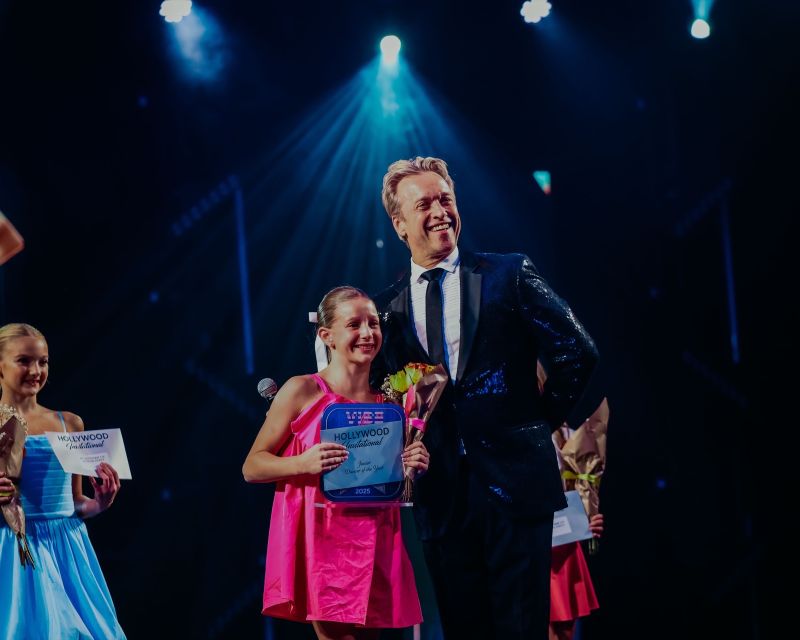 National Director Christopher Smith with Dancer of the Year on stage